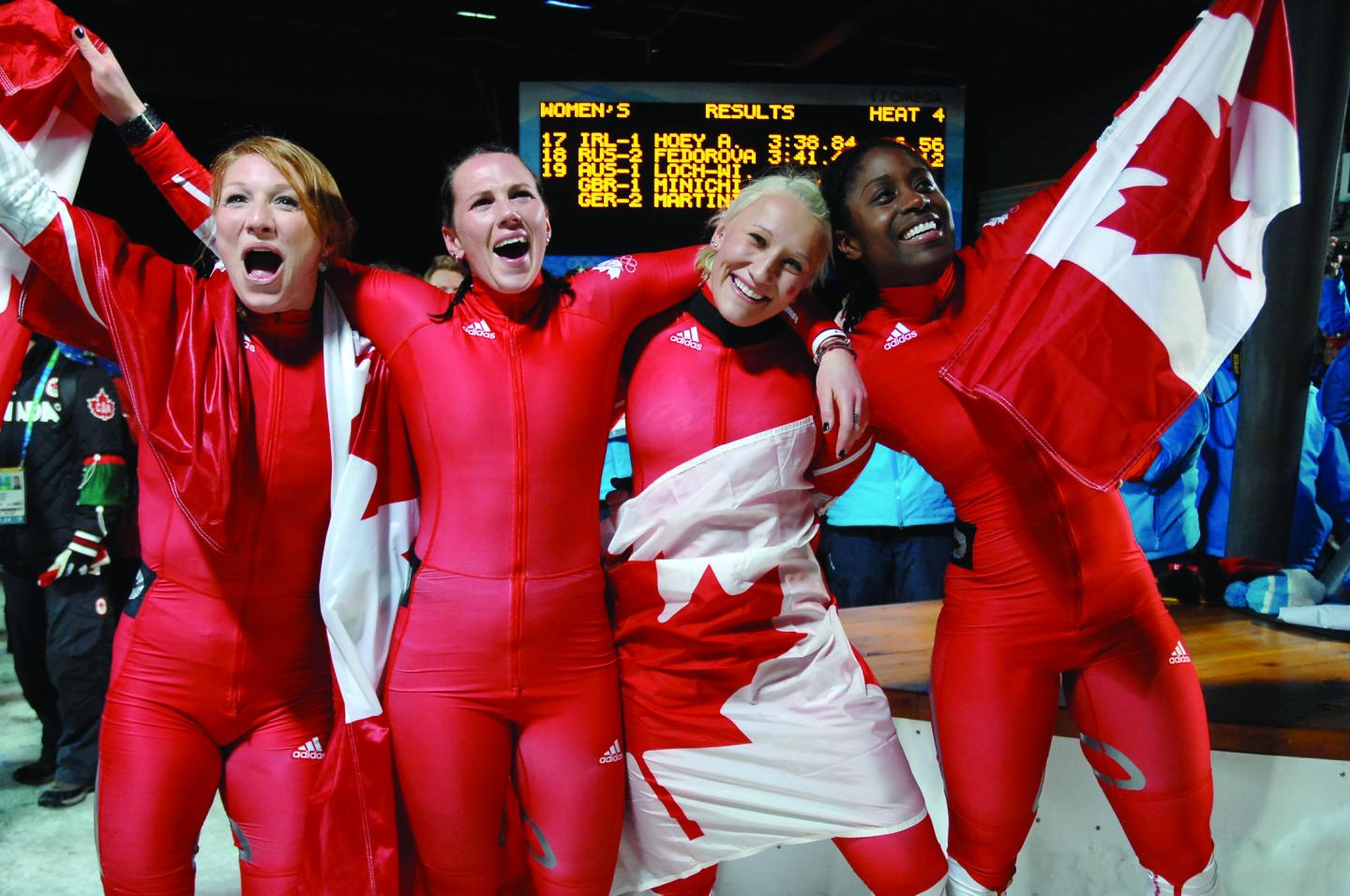 Team Canada girls with flags celebrating